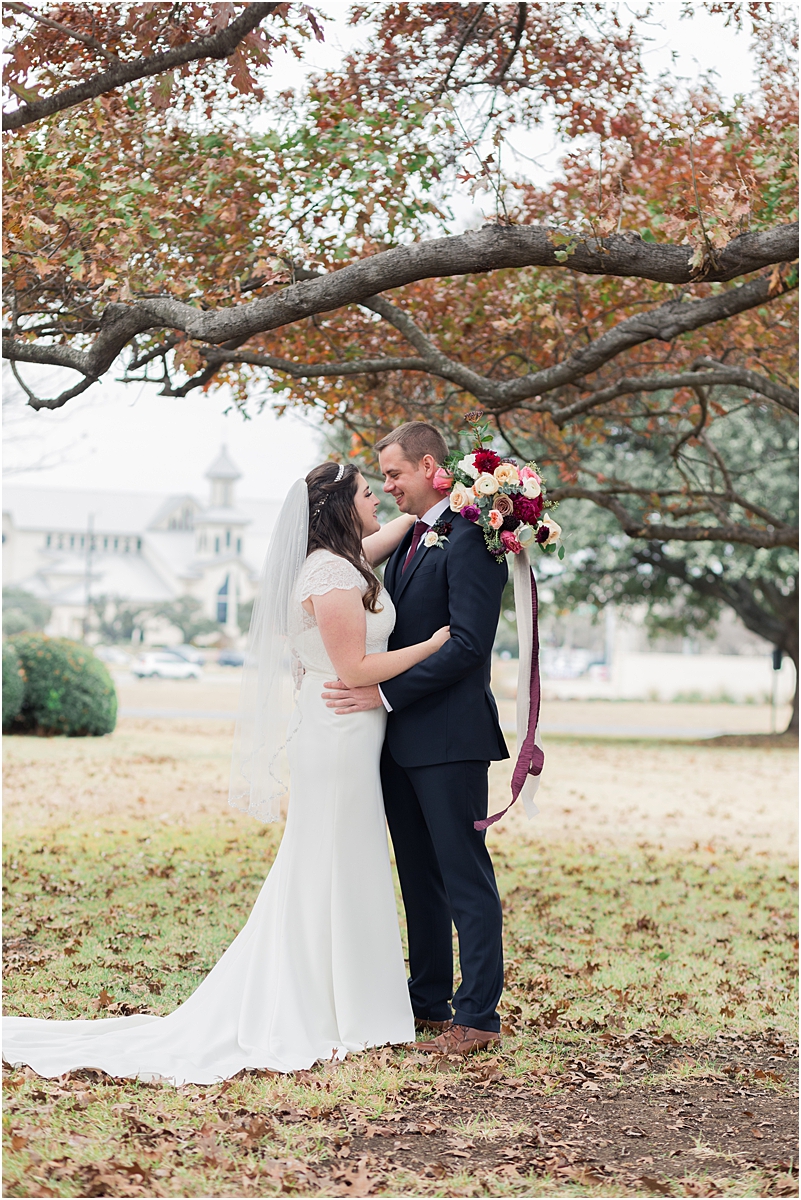 At this beautiful Austin winter wedding, Jared stood waiting on the side of the chapel, under a tree. Lisa, about 10 paces behind him, took a deep breath.