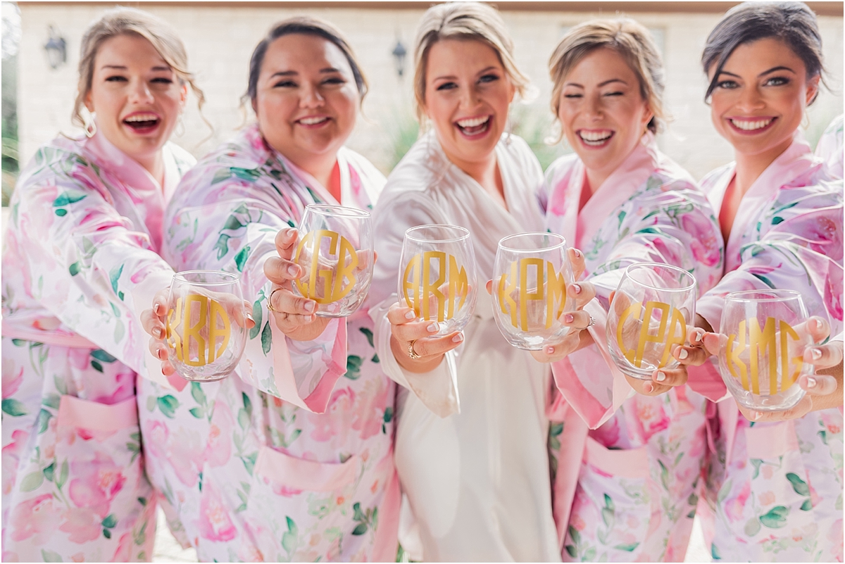 Austin Wedding photographer, wedding day timeline, getting ready, bridal portraits, getting ready photo, ATX weddings, pink bridesmaids robes, rose robes, monogramed wine glasses 