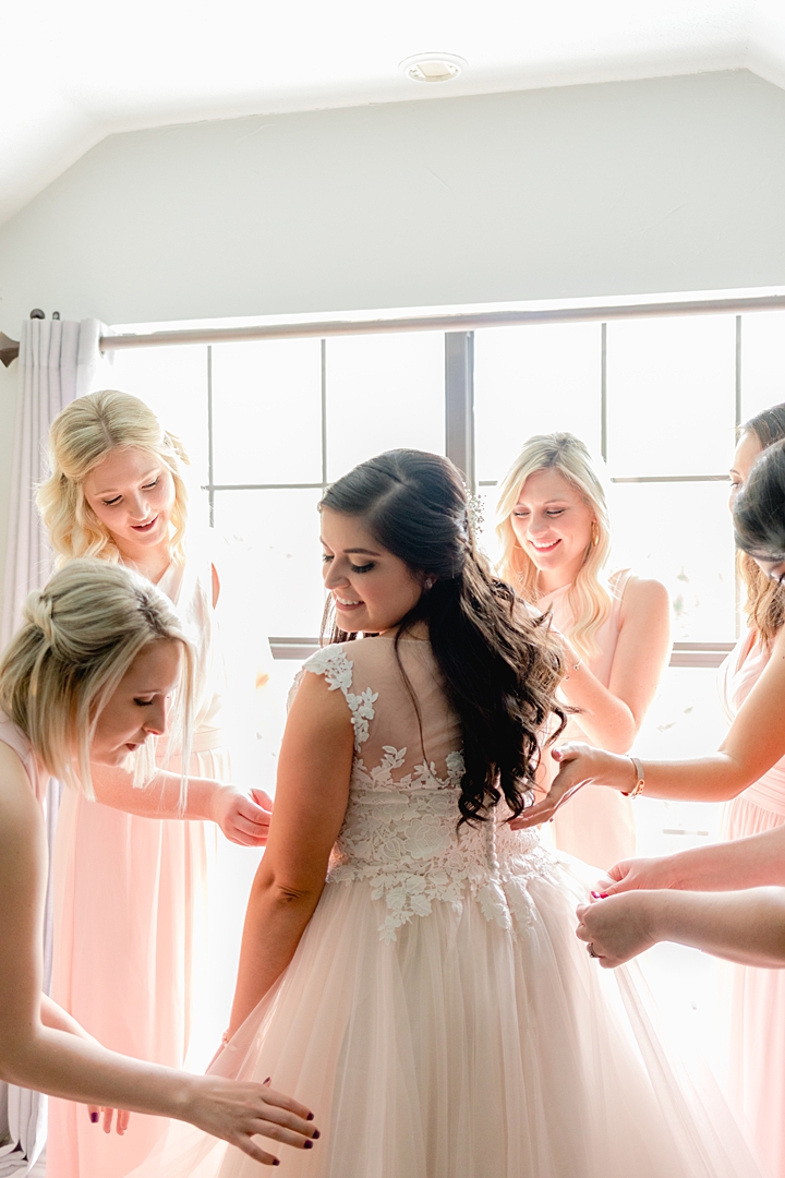 Pink bridesmaids dresses for the getting ready shots! "Not to be cheesy, but everything just made sense.” This Vista West Ranch wedding features the sweetest love story!! Click through to read more!