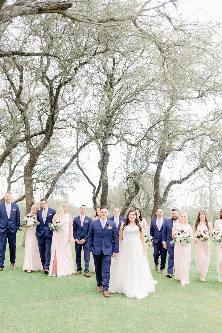 Navy suits for the groomsmen and pink bridesmaids dresses! "Not to be cheesy, but everything just made sense.” This Vista West Ranch wedding features the sweetest love story!! Click through to read more!