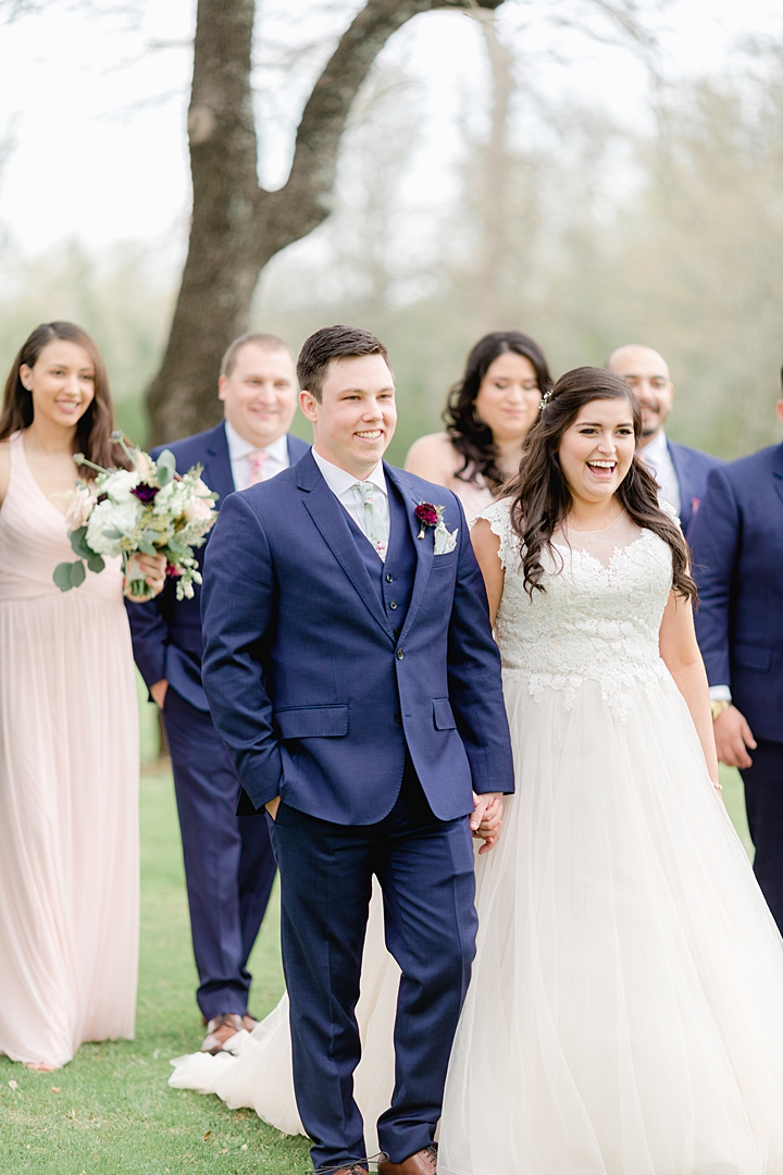 Navy suits for the groomsmen and pink bridesmaids dresses! "Not to be cheesy, but everything just made sense.” This Vista West Ranch wedding features the sweetest love story!! Click through to read more!
