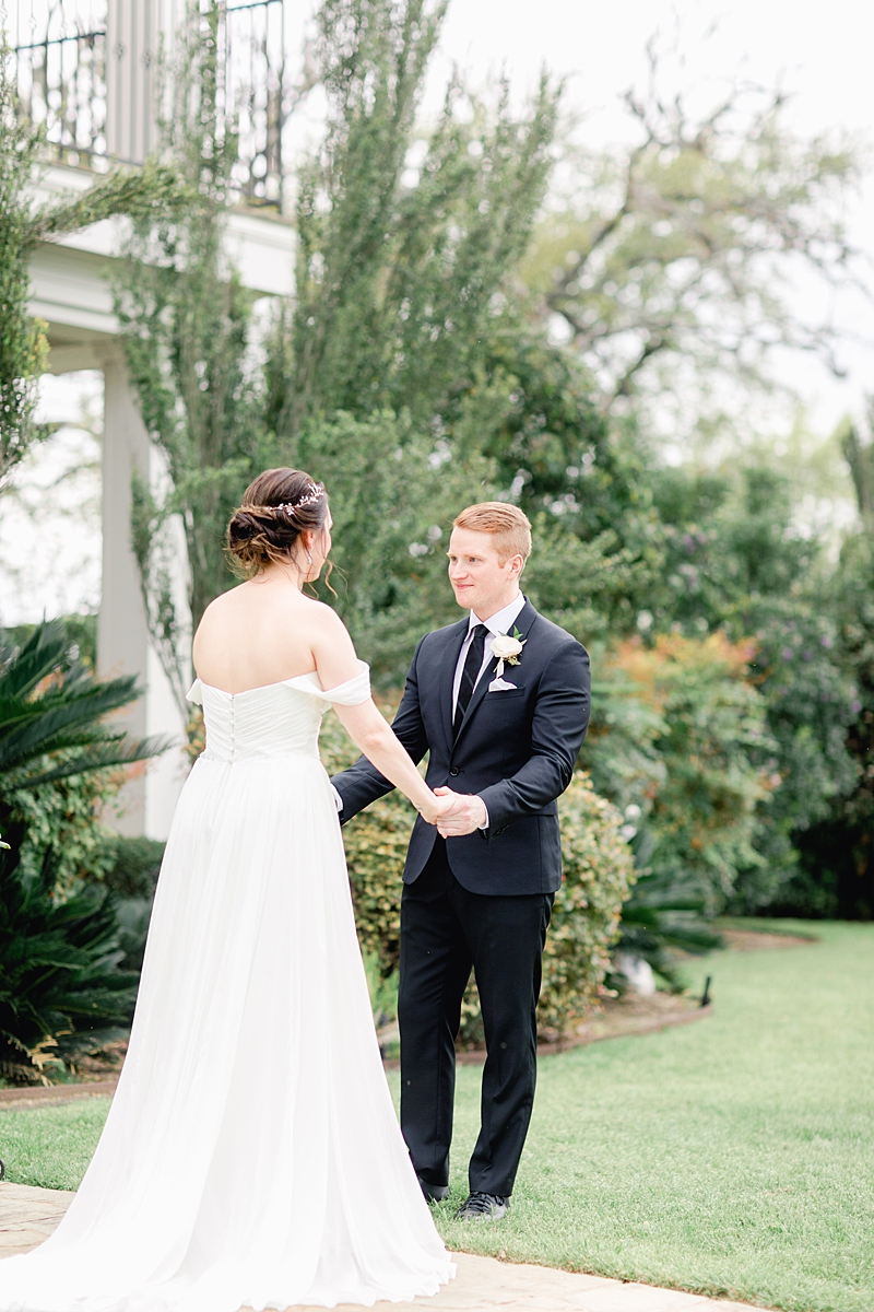 The first look moment! An elegant Springtime Antebellum Oaks wedding in Austin, Texas is what dreams are made of! Navy and blush accents, cookie cakes, and more!