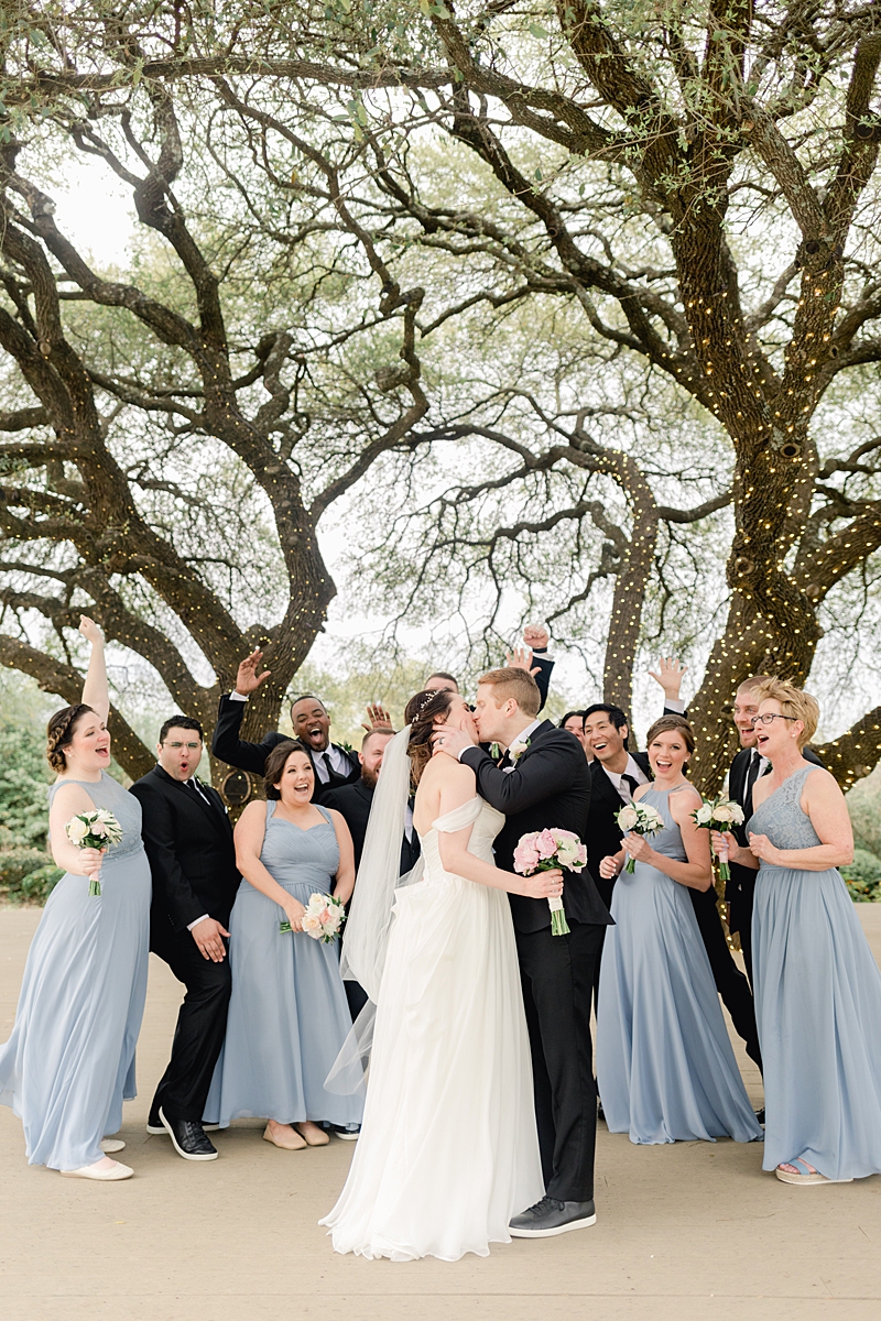 Classic bridesmads in Dusty Blue Azazie.com dresses and groomsmen in Indochino! An elegant Springtime Antebellum Oaks wedding in Austin, Texas is what dreams are made of! Navy and blush accents, cookie cakes, and more!