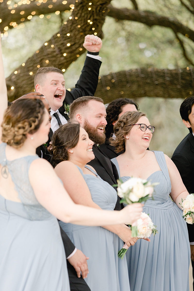 Classic bridesmads in Dusty Blue Azazie.com dresses and groomsmen in Indochino! An elegant Springtime Antebellum Oaks wedding in Austin, Texas is what dreams are made of! Navy and blush accents, cookie cakes, and more!