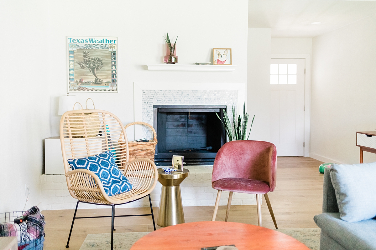 Gold plant stand and rattan chair from target, pink chair from amazon. I love the marbled tile around the fireplace! We're in South Austin, Texas in a neighborhood called Cherry Creek. Click through to see how we've settled so far!