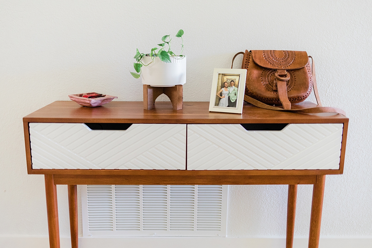 Console table from Target. We're in South Austin, Texas in a neighborhood called Cherry Creek. Click through to see how we've settled so far!