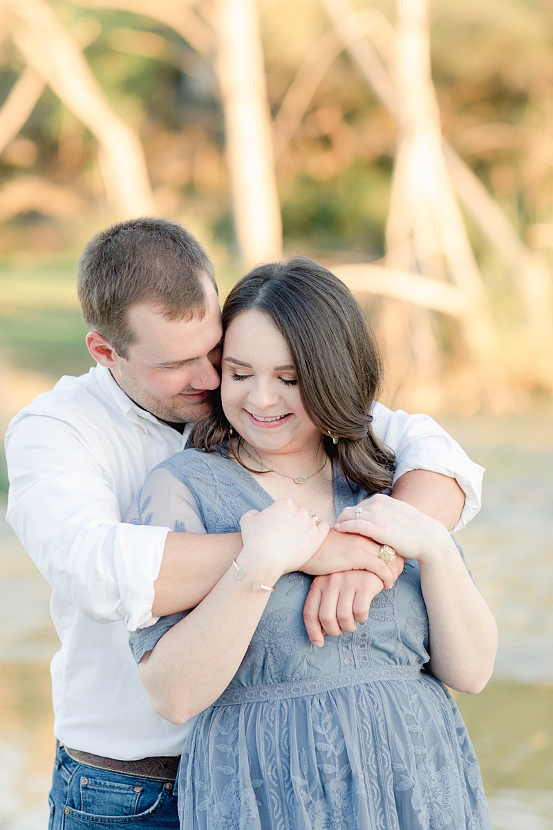 Chelsea & Drew's engagement session at The Waters Point was so dreamy! They hopped right into the river! I love her navy blue embroidered dress. Outfit Inspiration for sure!