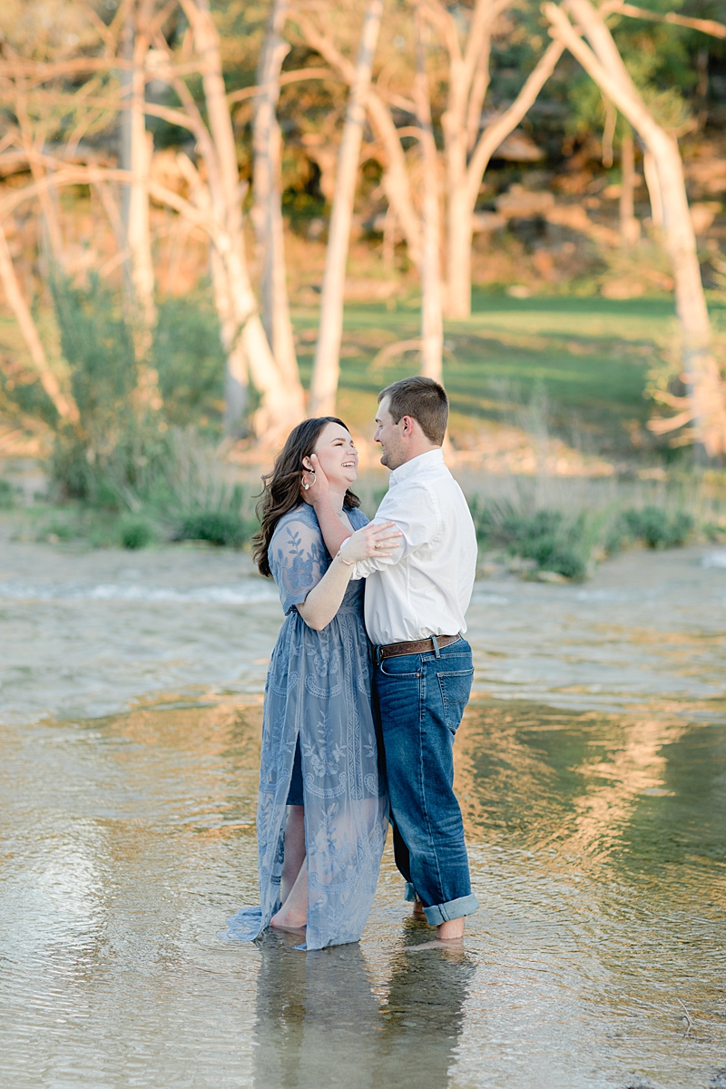 Chelsea & Drew's engagement session at The Waters Point was so dreamy! They hopped right into the river! I love her navy blue embroidered dress. Outfit Inspiration for sure!