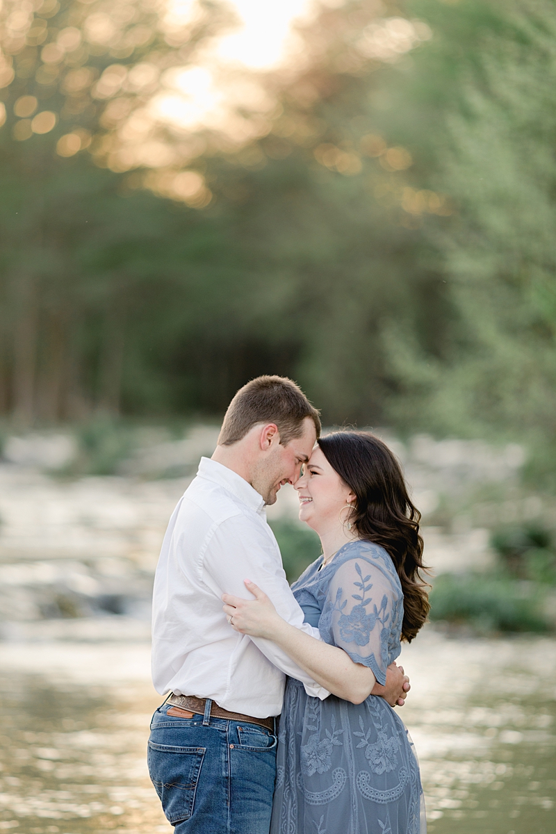 Chelsea & Drew's engagement session at The Waters Point was so dreamy! They hopped right into the river! I love her navy blue embroidered dress. Outfit Inspiration for sure!