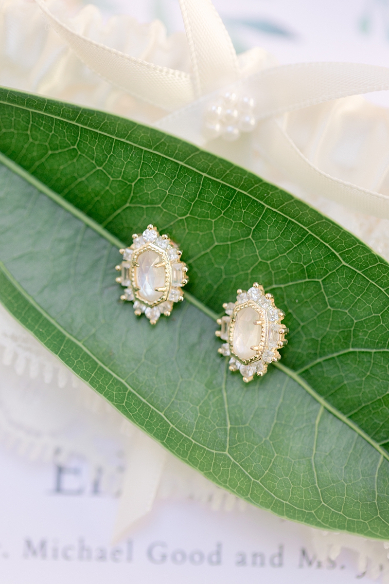 Kendra scott bridal bride stud earrings, details on a tiled floor, Austin Texas wedding photographer. Click through to see all the beautiful details from this wedding!