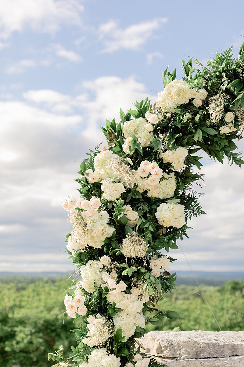 Floral arch at the ceremony site at Rancho Mirando, overlooking the Texas Hill Country! Austin Texas wedding photographer. Click through to see all the beautiful details from this wedding!