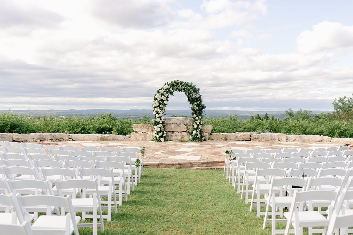 Floral arch at the ceremony site at Rancho Mirando, overlooking the Texas Hill Country! Austin Texas wedding photographer. Click through to see all the beautiful details from this wedding!