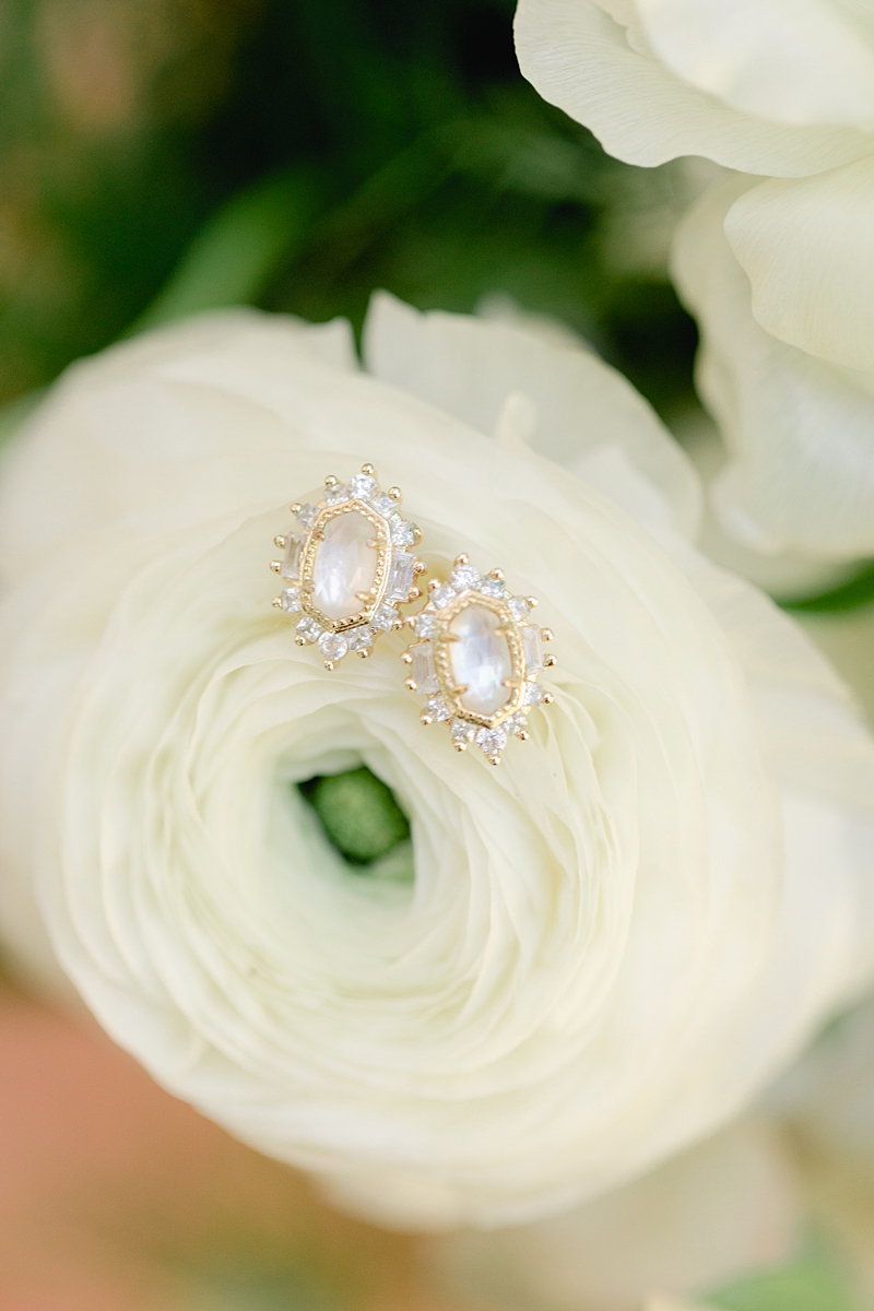 Kendra scott bridal bride stud earrings, details on a tiled floor, Austin Texas wedding photographer. Click through to see all the beautiful details from this wedding!