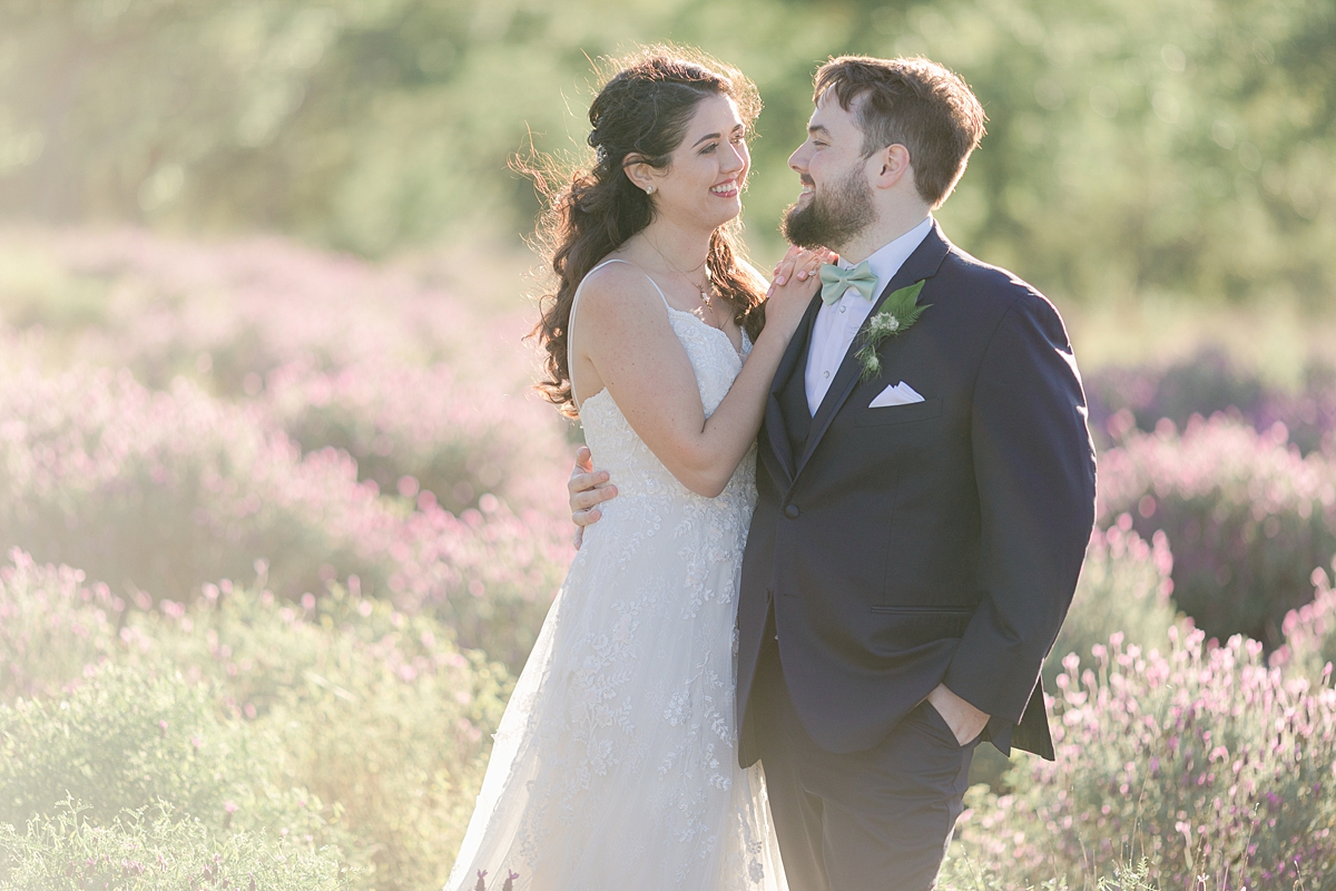 Husband and wife portraits in the lavender fields, at Rancho Mirando, Austin Texas wedding photographer. Click through to see all the beautiful details from this wedding!