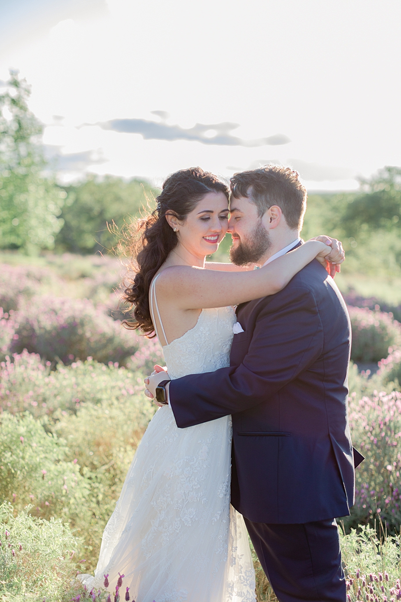 Husband and wife portraits in the lavender fields, at Rancho Mirando, Austin Texas wedding photographer. Click through to see all the beautiful details from this wedding!