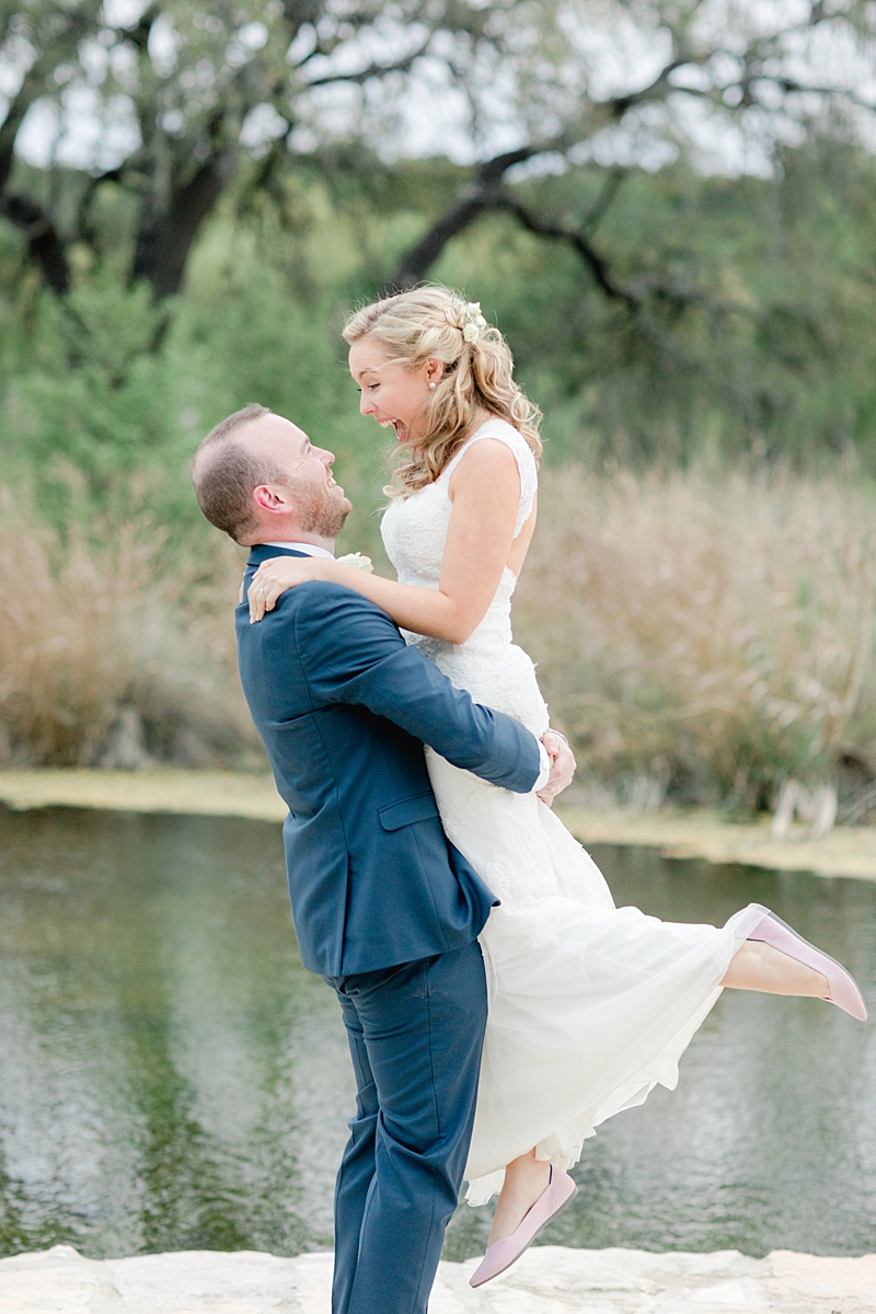 Sunset photo time in front of the seasonal creek! So many handpicked, thoughtful details here in and around this wedding in the Texas Hill Country, near Austin. Click through to see the most perfect wedding day!