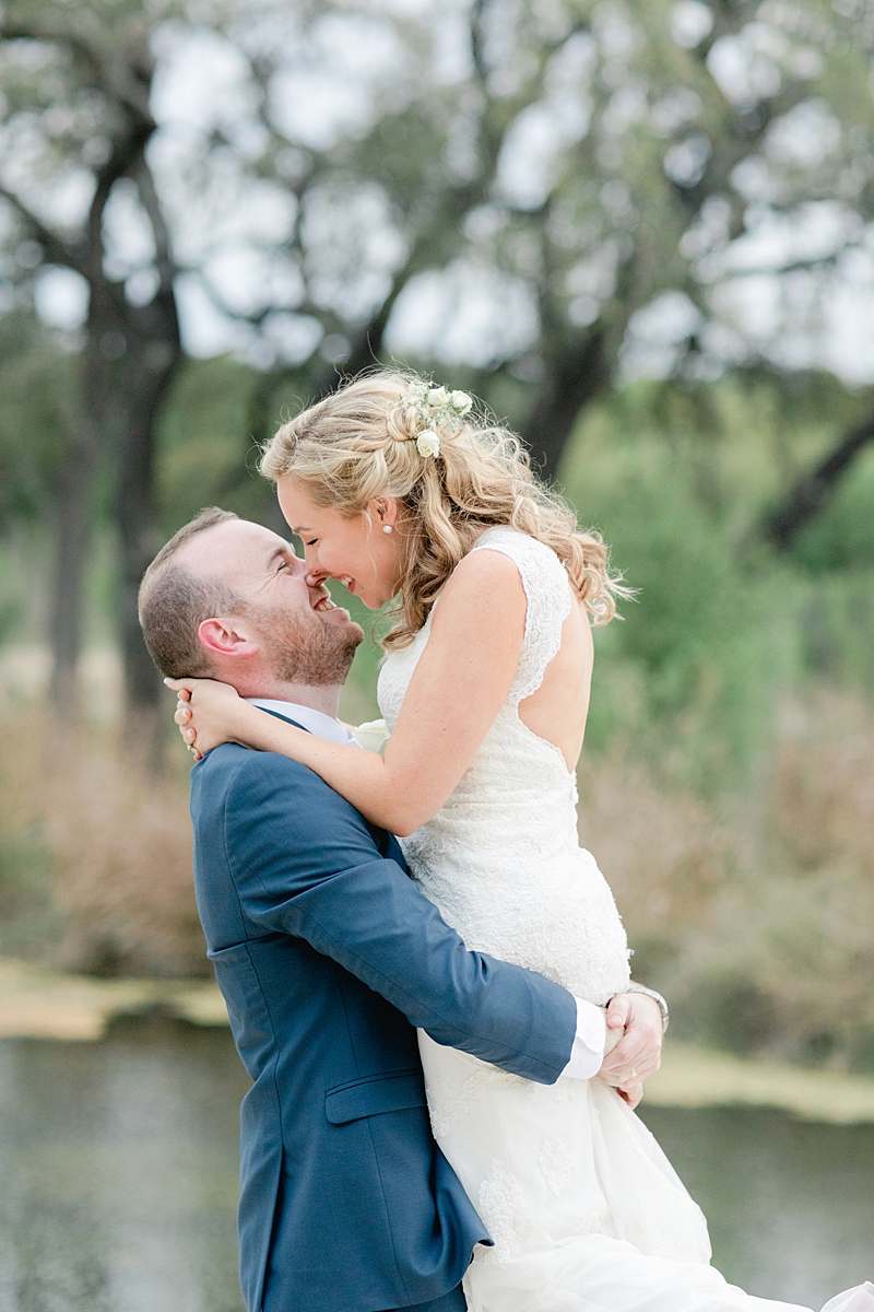 Sunset photo time in front of the seasonal creek! So many handpicked, thoughtful details here in and around this wedding in the Texas Hill Country, near Austin. Click through to see the most perfect wedding day!