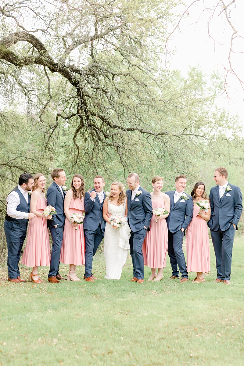 The bridal party used Rent the Runway for the bridesmaids dresses and Generation Tux! So many handpicked, thoughtful details here in and around this wedding in Dripping Springs, Texas. Click through to see the most perfect wedding day!