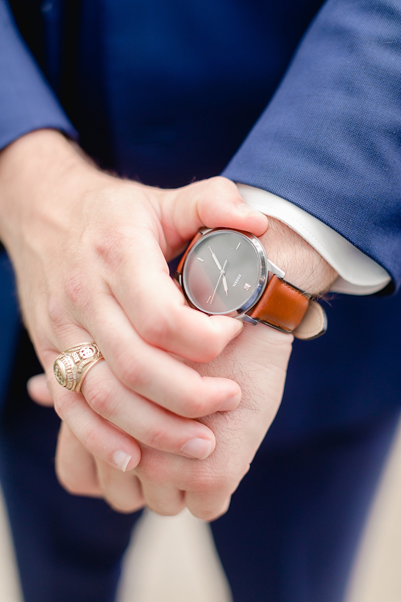 This summertime, Texas Hill Country wedding at Vista West Ranch features sweet blush details and navy blue suits. The perfect warm weather wedding day!