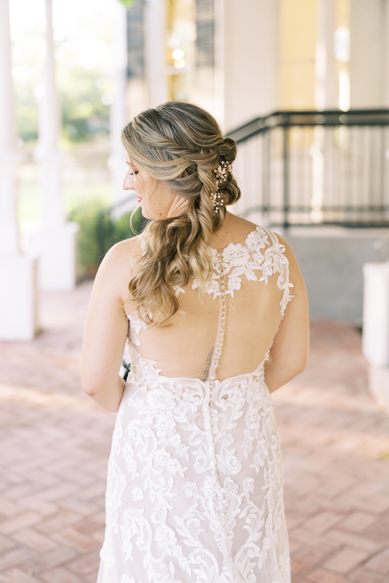 Bridal session at the brand new Austin wedding venue Woodbine Mansion, a historic 19th century home in Round Rock. Classic half up half down bridal updo with a floral hairpiece. 