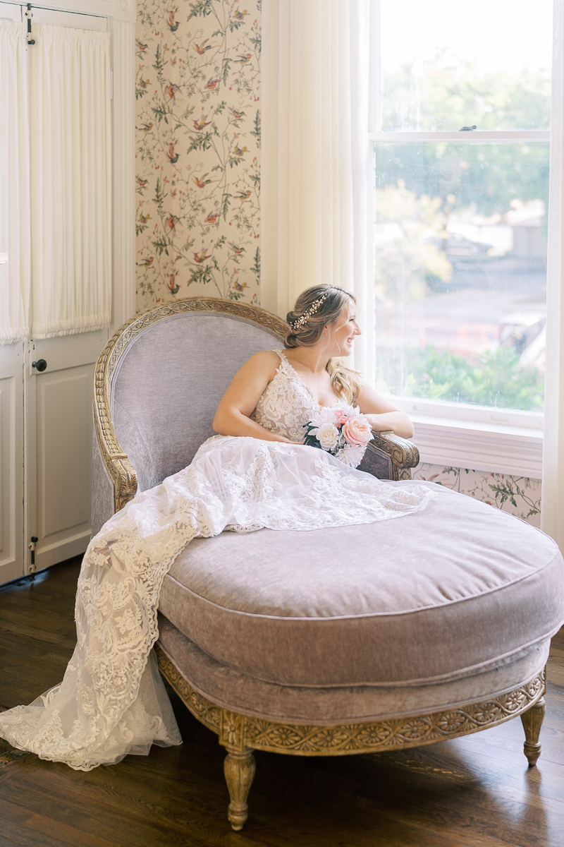 Bridal session at the brand new Austin wedding venue Woodbine Mansion, a historic 19th century home in Round Rock. Classic half up half down bridal updo with a floral hairpiece. 