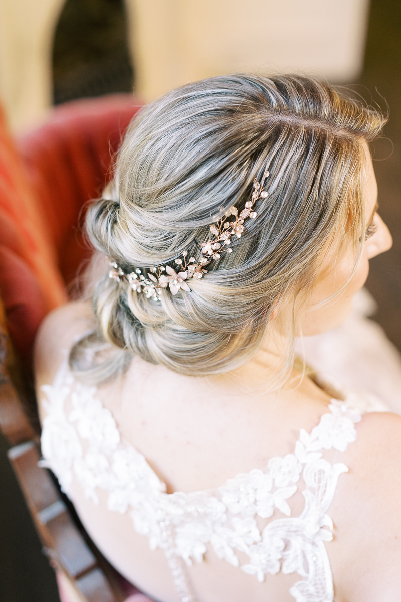 Bridal session at the brand new Austin wedding venue Woodbine Mansion, a historic 19th century home in Round Rock. Classic half up half down bridal updo with a floral hairpiece. 