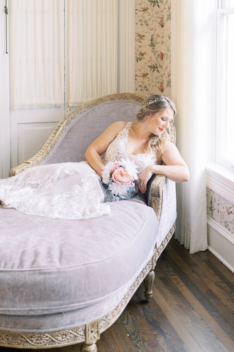 Bridal session at the brand new Austin wedding venue Woodbine Mansion, a historic 19th century home in Round Rock. Classic half up half down bridal updo with a floral hairpiece.