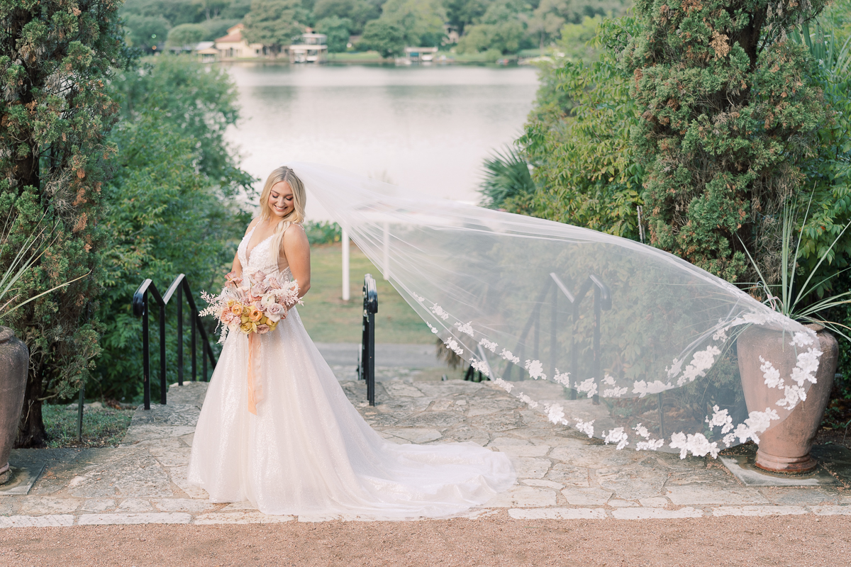 This bridal session at Laguna Gloria is the perfect classic, romantic bridals! With florals from Remi + Gold and the most sparkly, glitter wedding dress! 