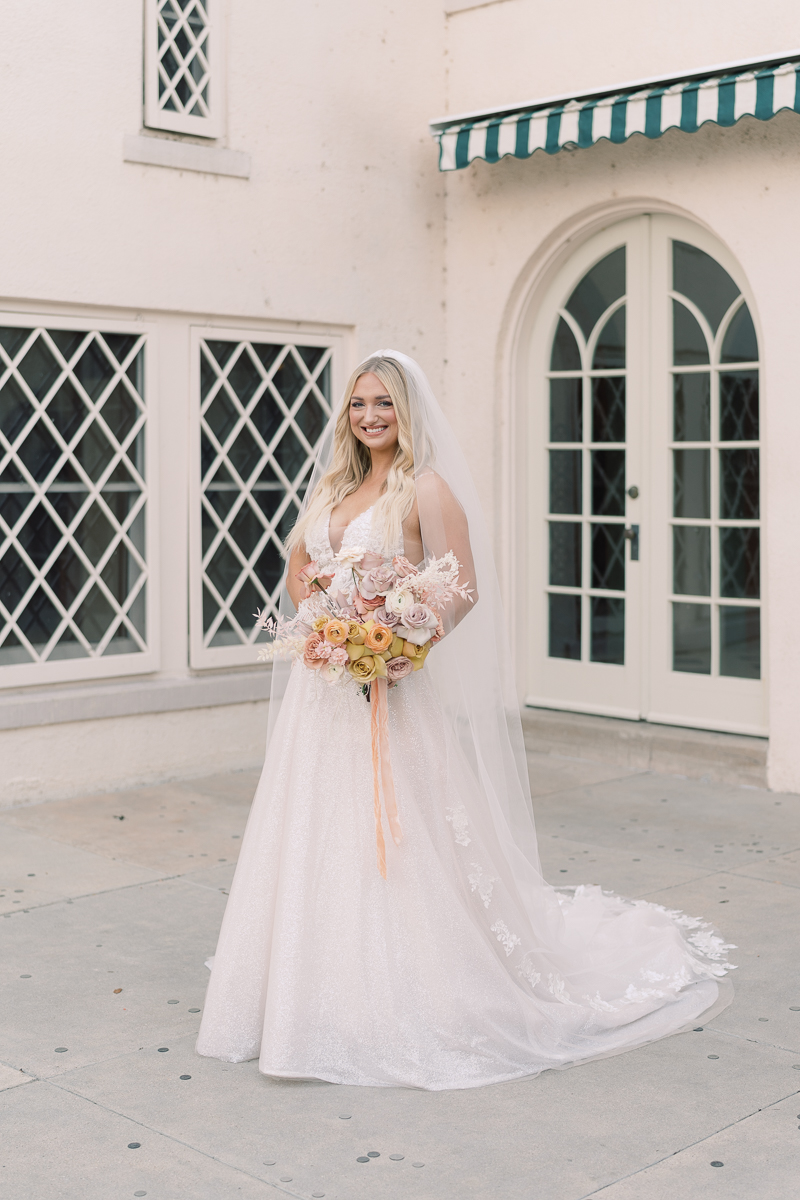 This bridal session at Laguna Gloria is the perfect classic, romantic bridals! With florals from Remi + Gold and the most sparkly, glitter wedding dress! 