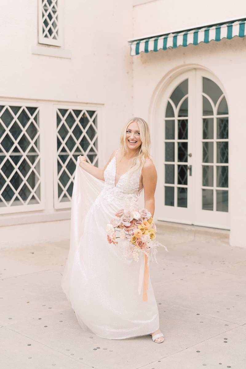 This bridal session at Laguna Gloria is the perfect classic, romantic bridals! With florals from Remi + Gold and the most sparkly, glitter wedding dress! 