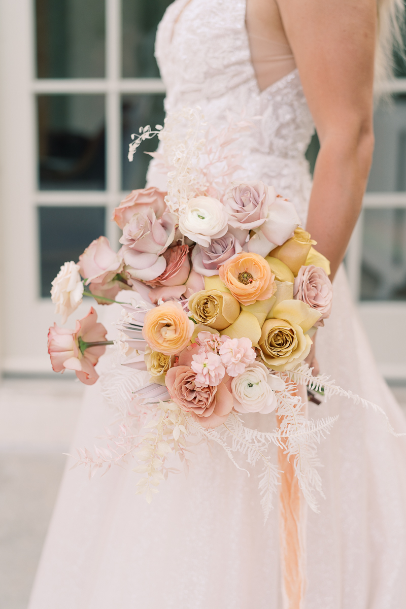 This bridal session at Laguna Gloria is the perfect classic, romantic bridals! With florals from Remi + Gold and the most sparkly, glitter wedding dress! 