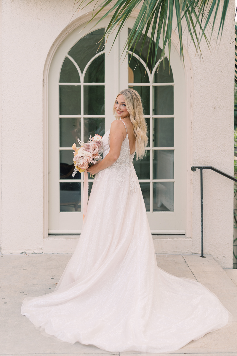 This bridal session at Laguna Gloria is the perfect classic, romantic bridals! With florals from Remi + Gold and the most sparkly, glitter wedding dress! 