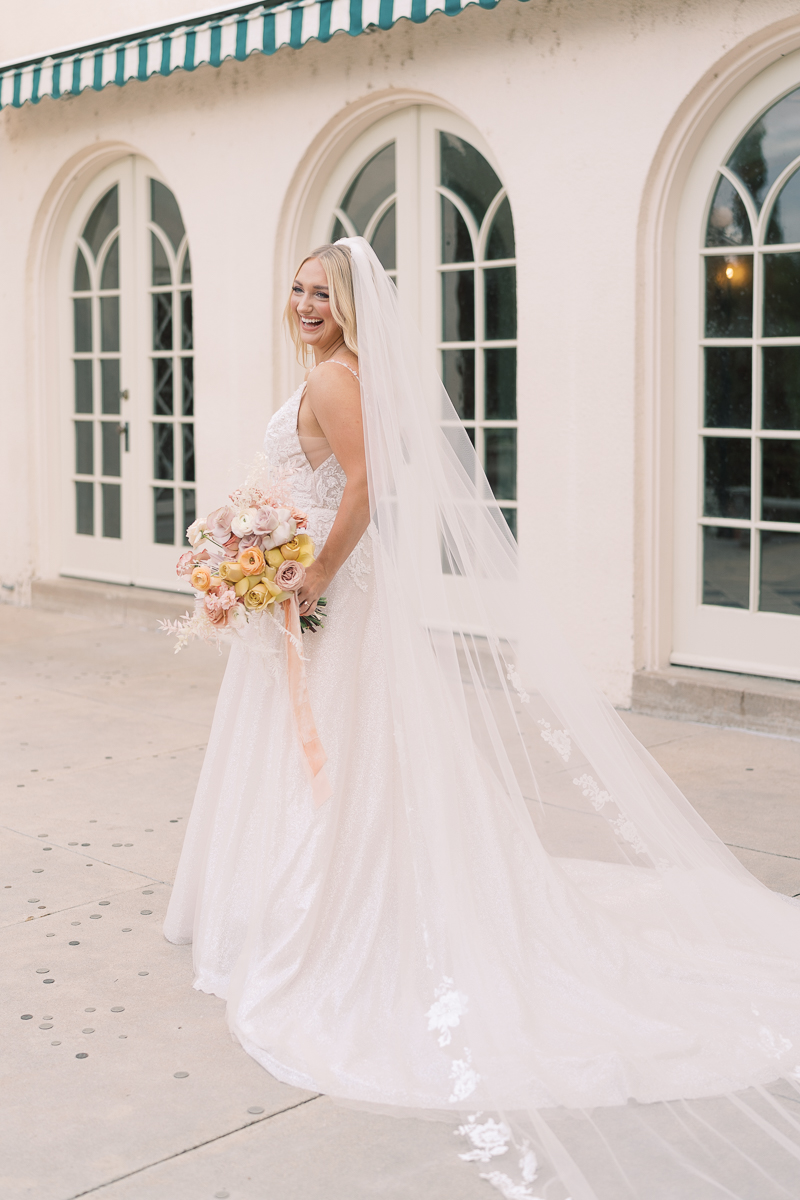 This bridal session at Laguna Gloria is the perfect classic, romantic bridals! With florals from Remi + Gold and the most sparkly, glitter wedding dress! 