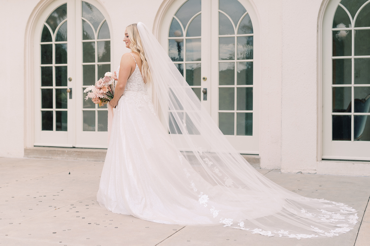 This bridal session at Laguna Gloria is the perfect classic, romantic bridals! With florals from Remi + Gold and the most sparkly, glitter wedding dress! 