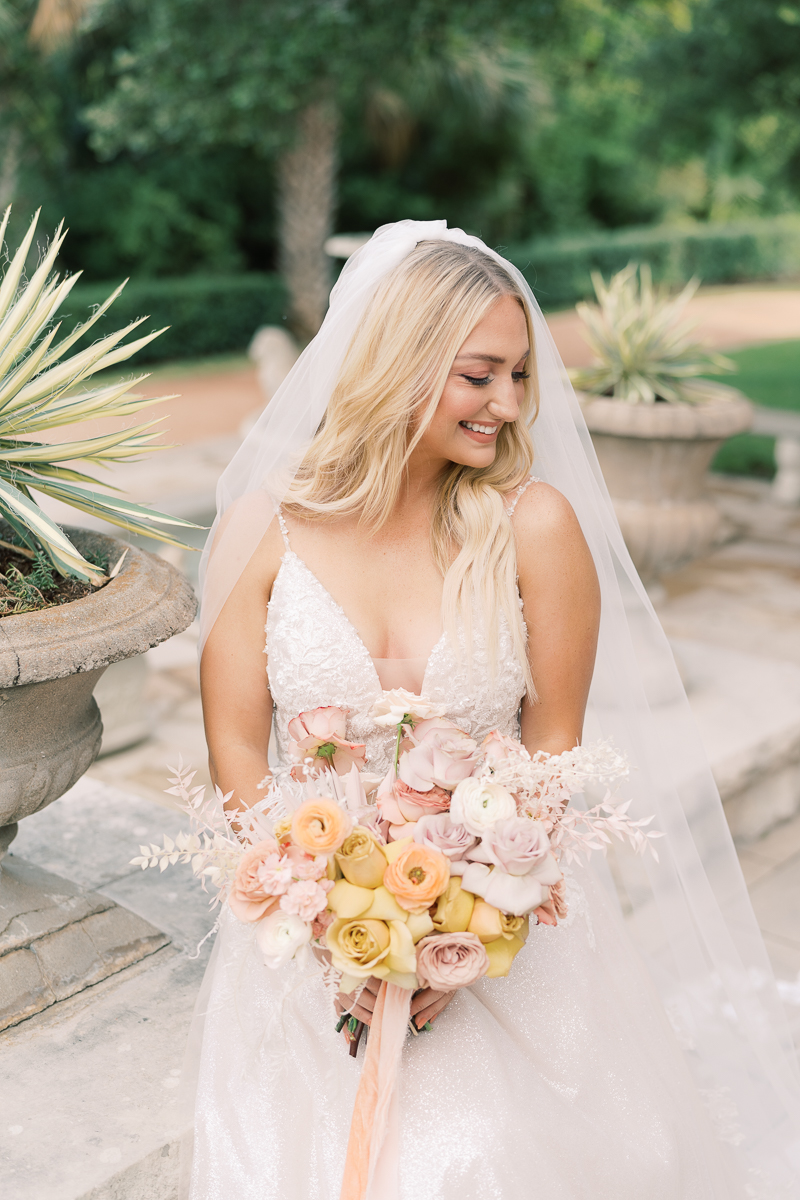 This bridal session at Laguna Gloria is the perfect classic, romantic bridals! With florals from Remi + Gold and the most sparkly, glitter wedding dress! 