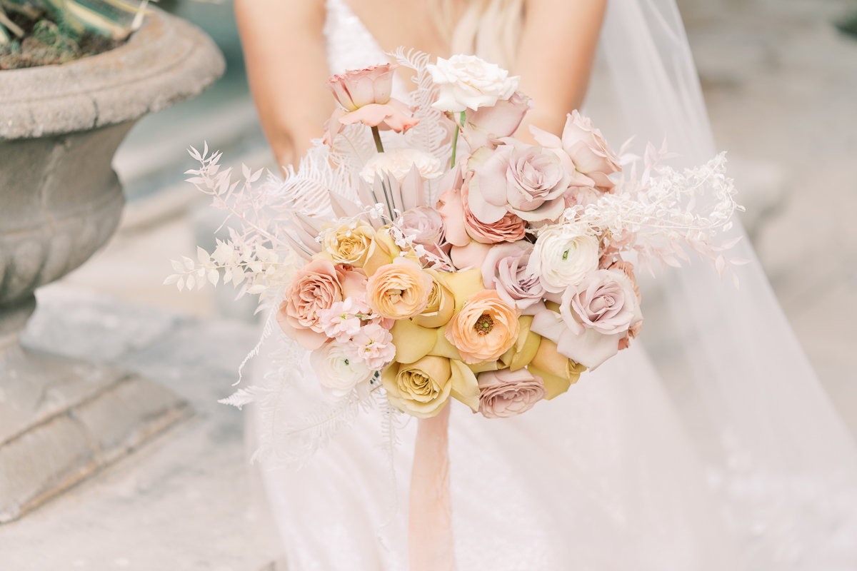 This bridal session at Laguna Gloria is the perfect classic, romantic bridals! With florals from Remi + Gold and the most sparkly, glitter wedding dress! 