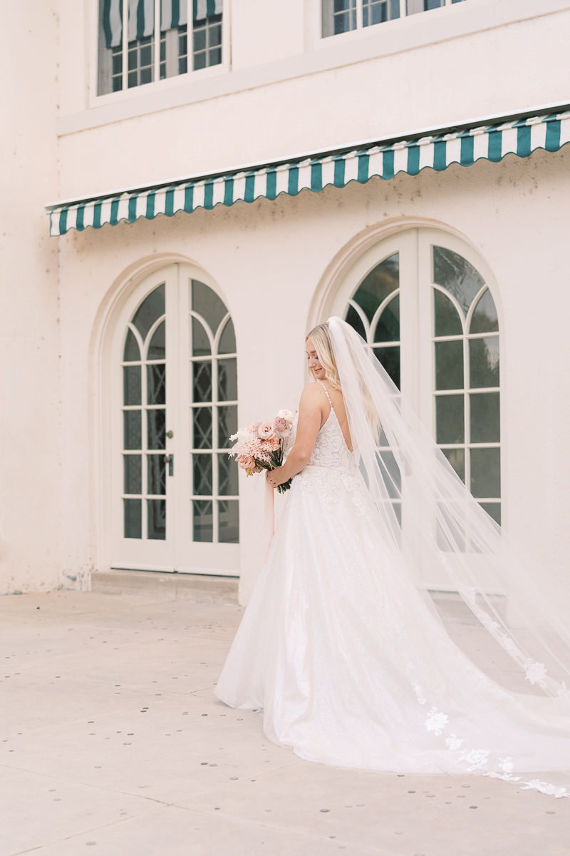 This bridal session at Laguna Gloria is the perfect classic, romantic bridals! With florals from Remi + Gold and the most sparkly, glitter wedding dress! 