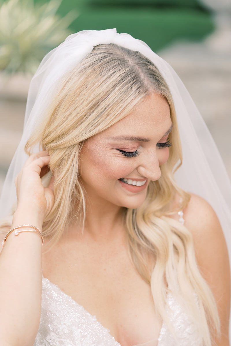 This bridal session at Laguna Gloria is the perfect classic, romantic bridals! With florals from Remi + Gold and the most sparkly, glitter wedding dress! 