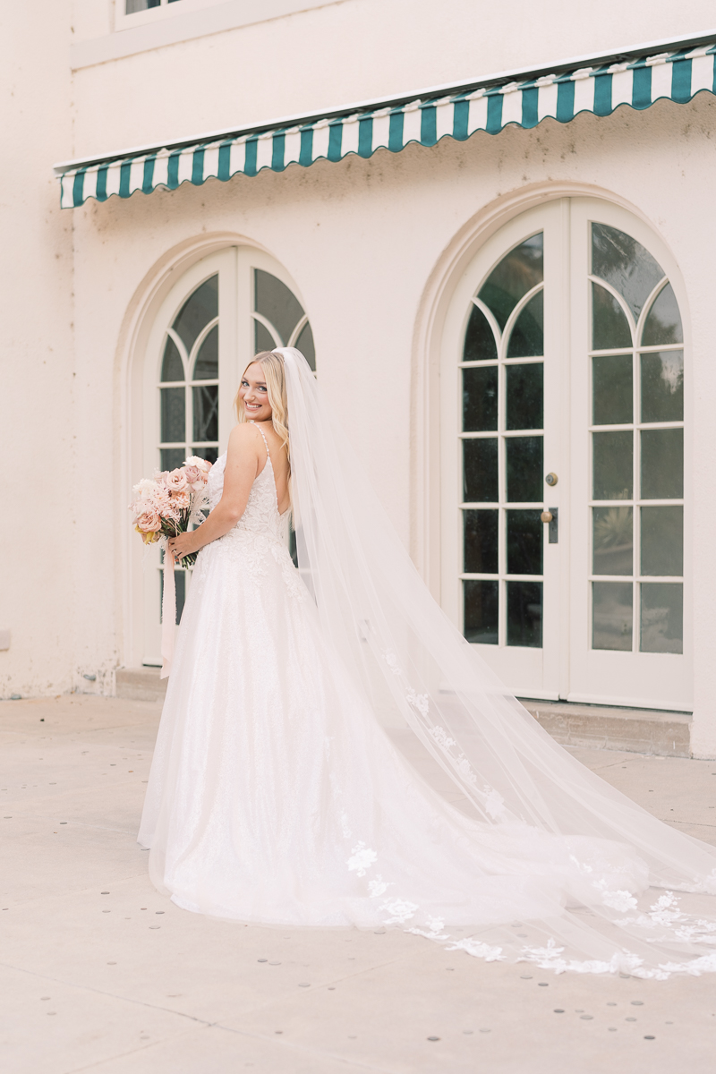 This bridal session at Laguna Gloria is the perfect classic, romantic bridals! With florals from Remi + Gold and the most sparkly, glitter wedding dress! 