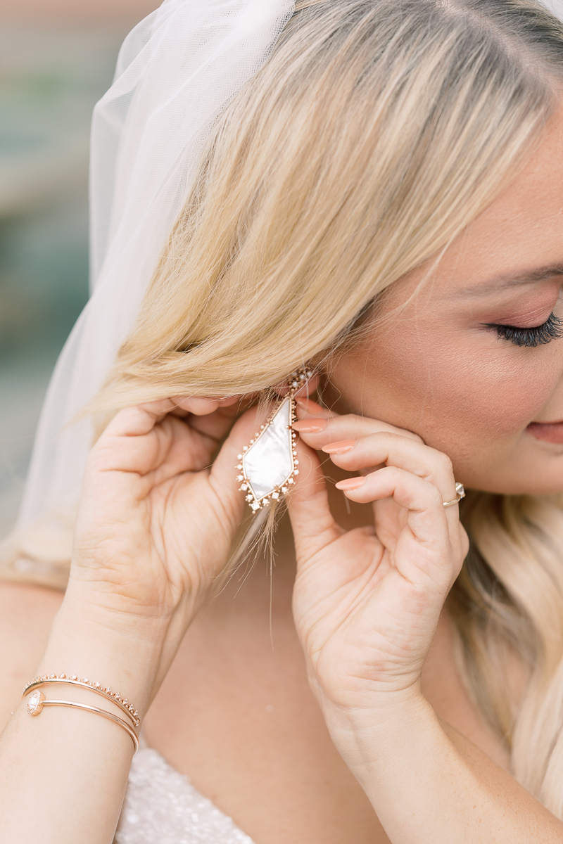 This bridal session at Laguna Gloria is the perfect classic, romantic bridals! With florals from Remi + Gold and the most sparkly, glitter wedding dress! 