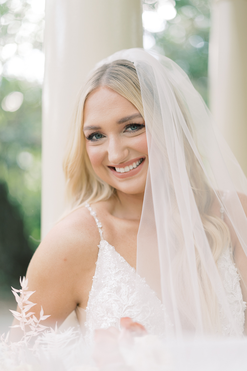 This bridal session at Laguna Gloria is the perfect classic, romantic bridals! With florals from Remi + Gold and the most sparkly, glitter wedding dress! 