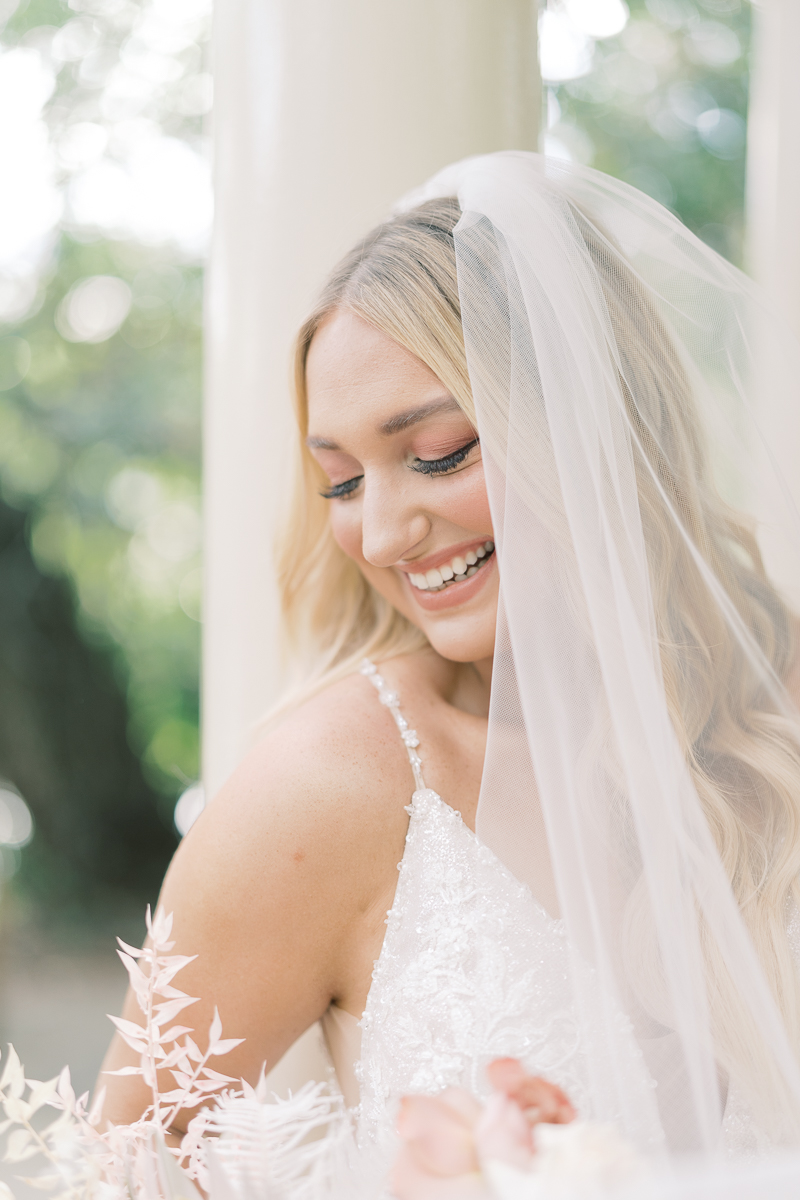 This bridal session at Laguna Gloria is the perfect classic, romantic bridals! With florals from Remi + Gold and the most sparkly, glitter wedding dress! 