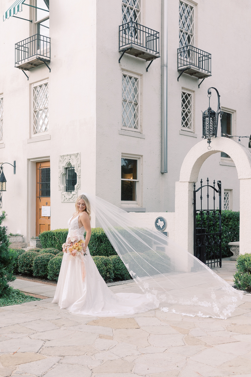 This bridal session at Laguna Gloria is the perfect classic, romantic bridals! With florals from Remi + Gold and the most sparkly, glitter wedding dress! 