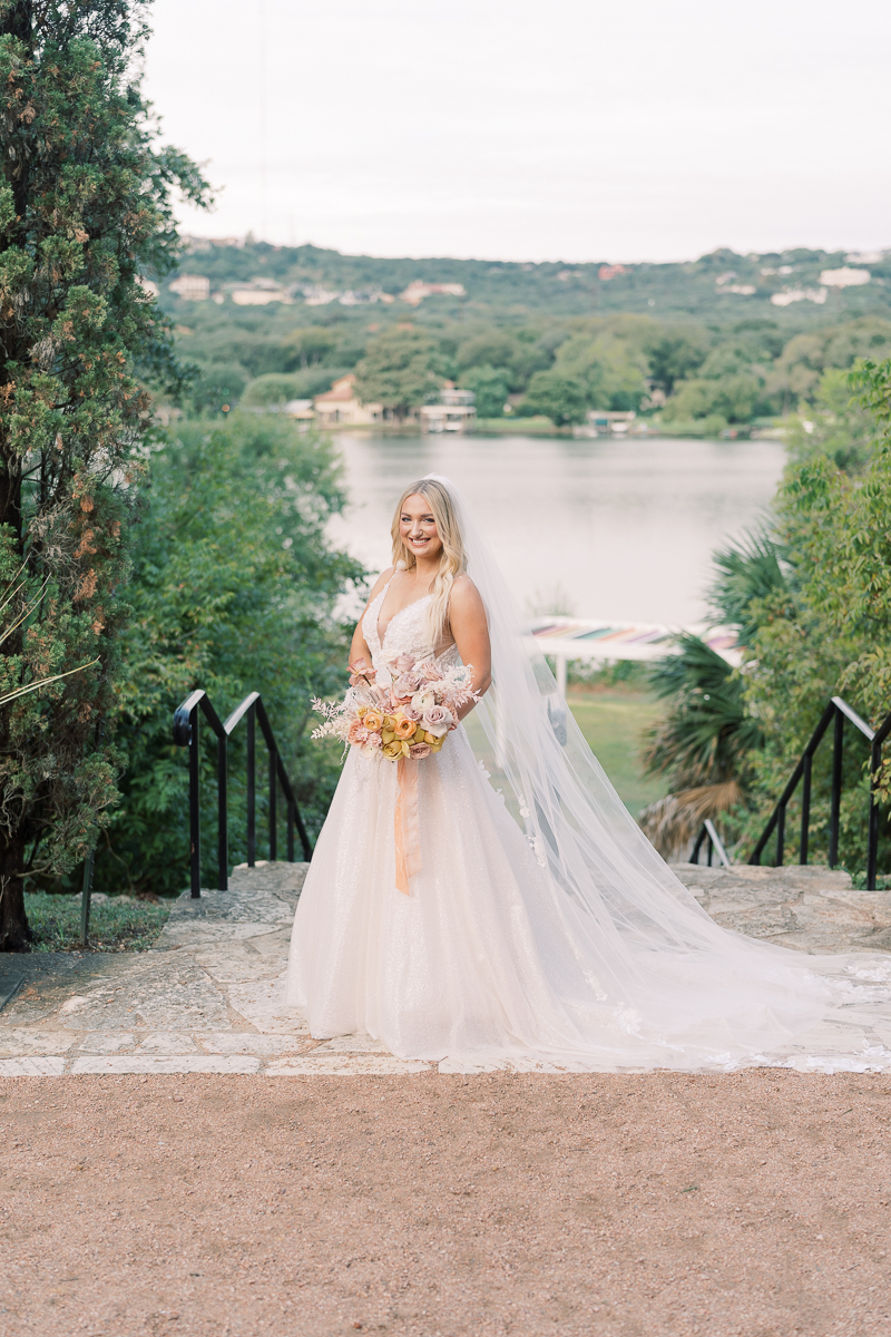 This bridal session at Laguna Gloria is the perfect classic, romantic bridals! With florals from Remi + Gold and the most sparkly, glitter wedding dress! 