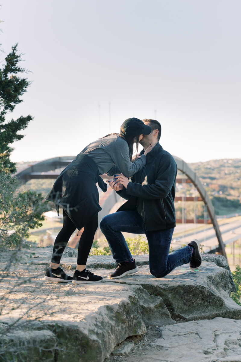 Lance proposed at the 360 Overlook in Austin, Texas, with town lake behind them and the 360 bridge! Click through to read their proposal story! 
