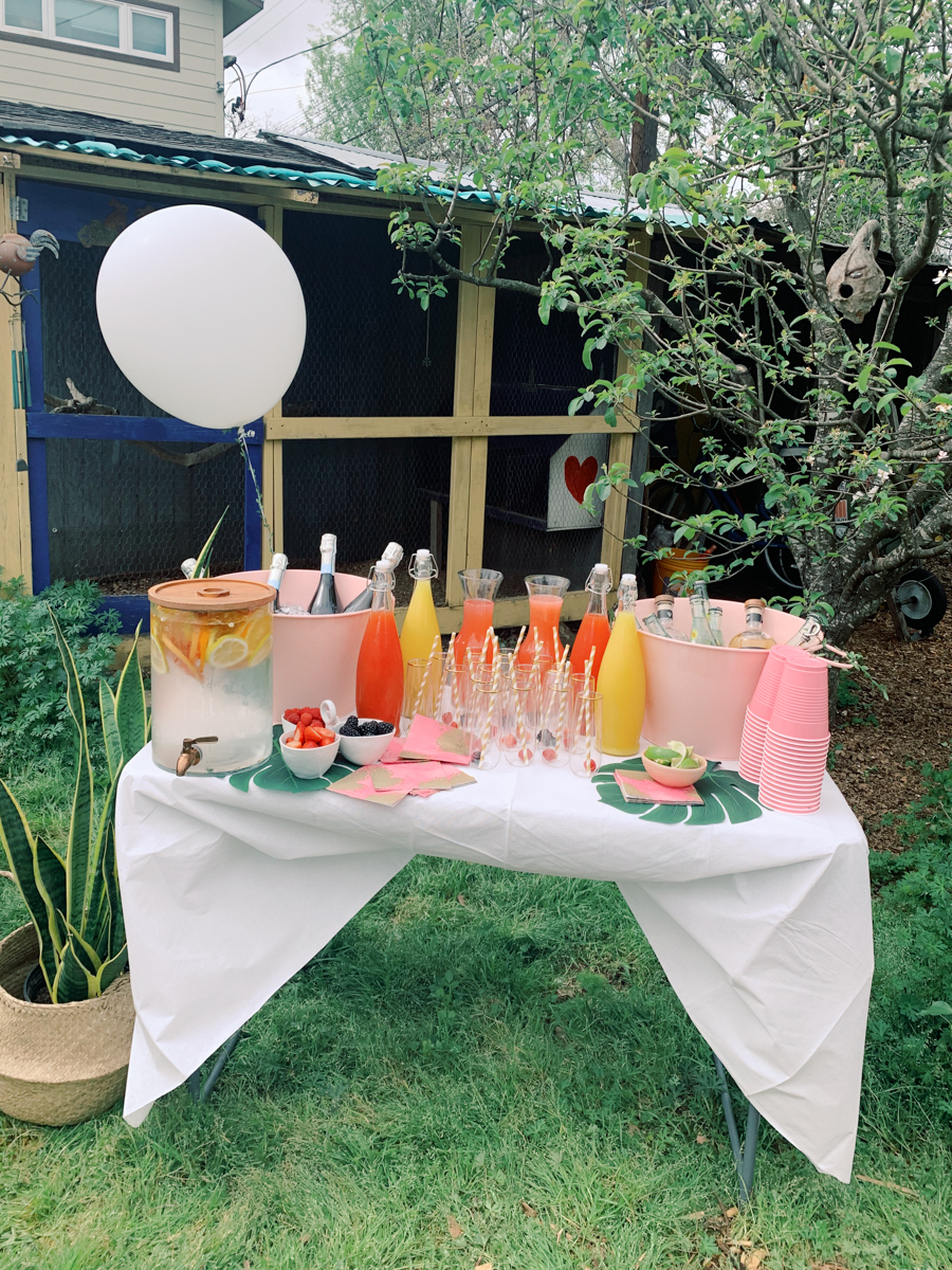 Backyard bridal shower, tropical coral theme! Thrown by the best bridesmaids ever, featuring paloma bar and a balloon arch!