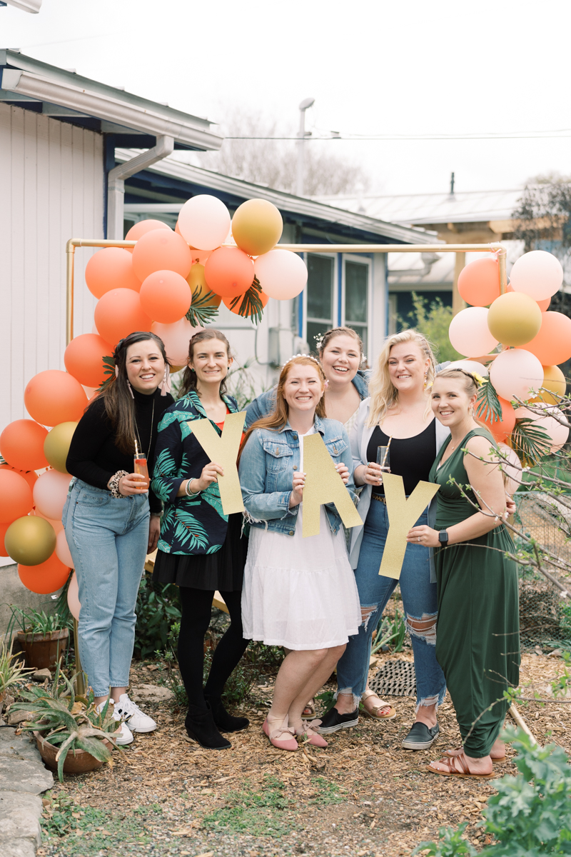 Backyard bridal shower, tropical coral theme! Thrown by the best bridesmaids ever, featuring paloma bar and a balloon arch!