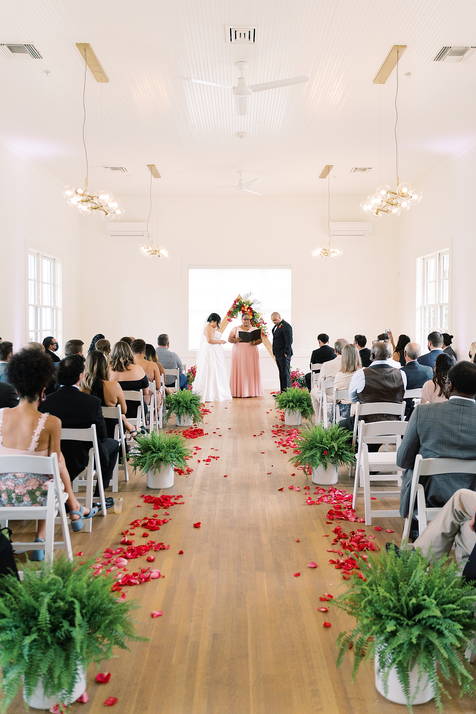 This love filled day at Springdale Station wedding had a surprise mariachi band and gorgeous details, designed by XO Moreau Events! You HAVE to see the bride's reception outfit! It's sparkly, tulle, and so fun! Click through to see this beautiful colorful Austin, TX wedding! #colorfulwedding #austinwedding #atxwedding