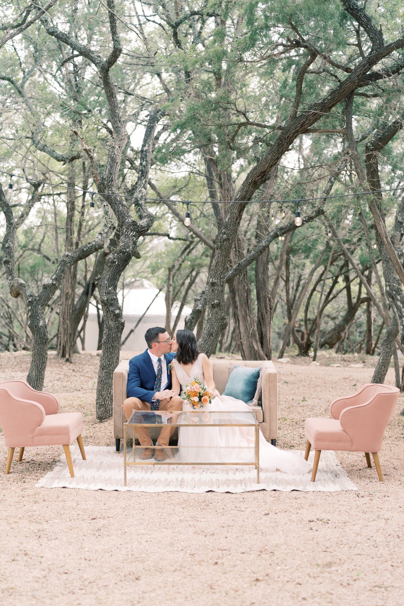 Pink, peach, navy and golden yellow make up my favorite trendy wedding color pallet - it's official! This wedding at this camp/hotel wedding venue is such a dream, you have to see! Set in the Texas hill country in Dripping Springs (with the most gorgeous view) Lucky Arrow Retreat is such a gem of a wedding venue! Click through to see Megan's BHLDN sparkly wedding dress, her perfect details, and the best party under the stars!