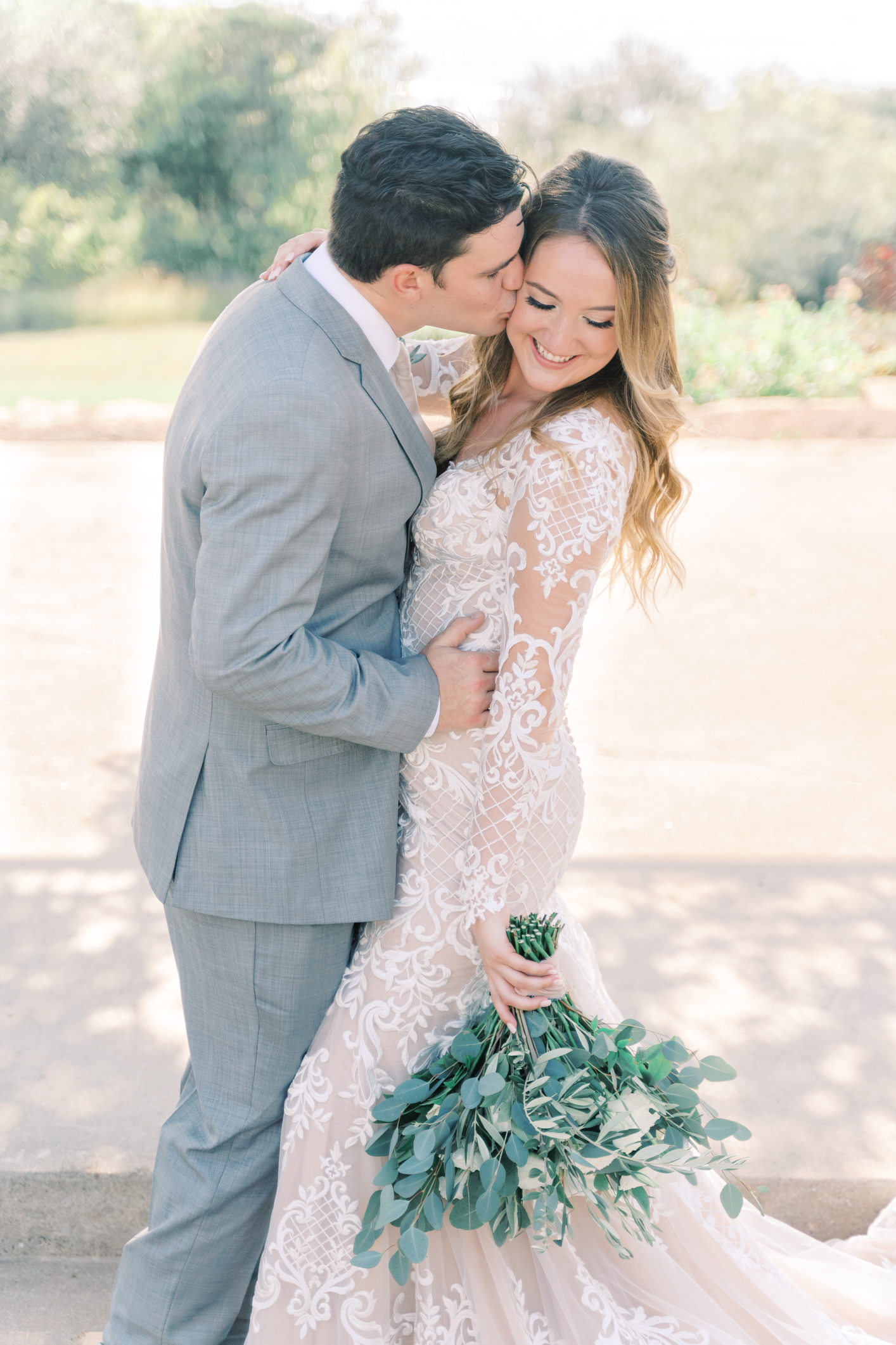 Jac's boho sheer, form fitting lace dress with gorgeous long sleeves is to die for! Their wedding day at Vintage Villas in Lakeway TX (near Austin) has the most beautiful sunset overlooking the water. You have to see for yourself! 